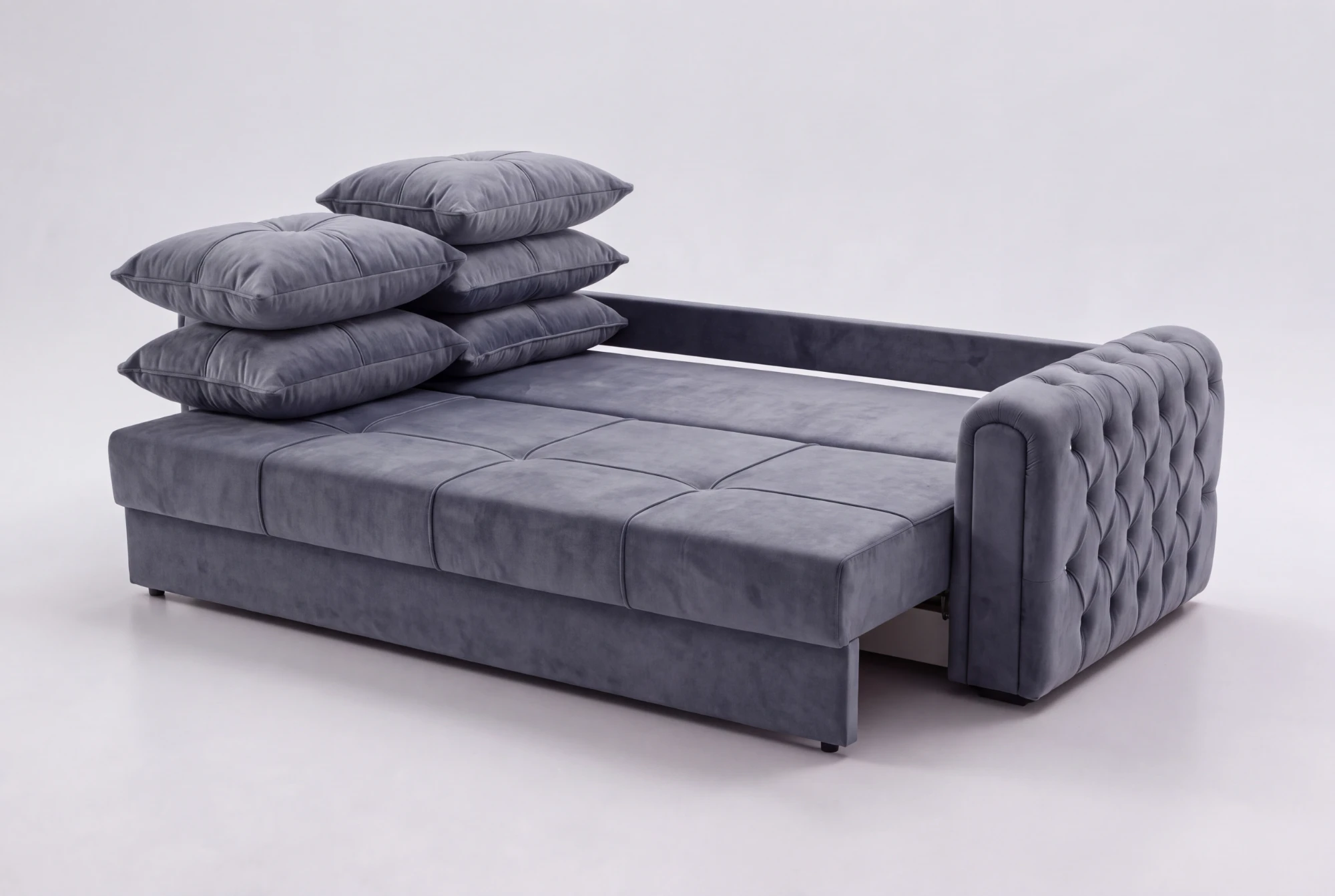 Olympos pulled out into a bed, with its back cushions stacked to one side