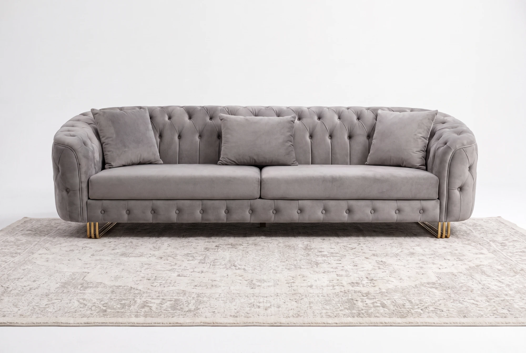 Tufted Royal sofa on a pale rug